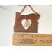 Photo of Copper I Love Oregon Ornament with Heart shape cutout in the middle and an Oregon Sunstone gemstone hanging inside the heart cutout, shown next to ruler for size reference
